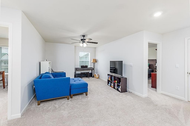 895 Garnet Dr, Acworth, GA 30101 - living area with carpet flooring, a ceiling fan, and plenty of natural light
