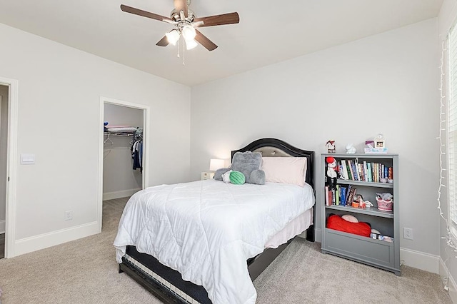 895 Garnet Dr, Acworth, GA 30101 - bedroom with carpet floors, a walk in closet, ceiling fan, and a closet