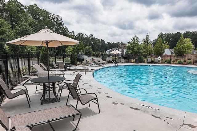 895 Garnet Dr, Acworth, GA 30101 - community pool with a patio area and view of wooded area