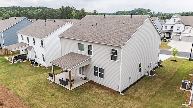 895 Garnet Dr, Acworth, GA 30101 - rear view of house featuring a patio area, a residential view, roof with shingles, and a lawn