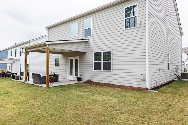 895 Garnet Dr, Acworth, GA 30101 - rear view of house featuring a patio area and a lawn