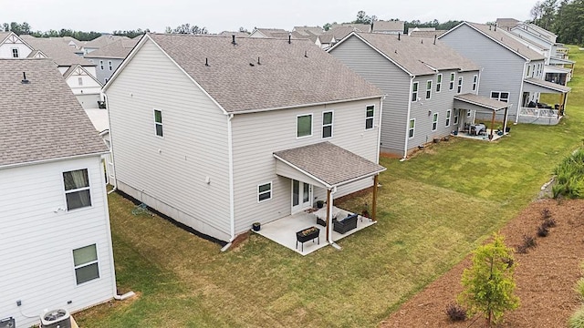 895 Garnet Dr, Acworth, GA 30101 - rear view of house featuring a patio, a residential view, a yard, and roof with shingles