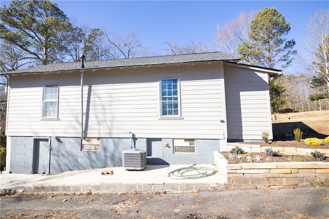 back of house featuring a patio area and central air condition unit