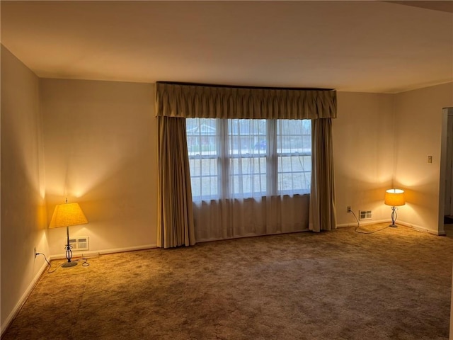 empty room featuring carpet floors