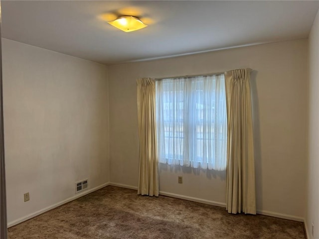 unfurnished room featuring carpet flooring