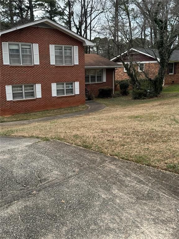 view of home's exterior with a yard