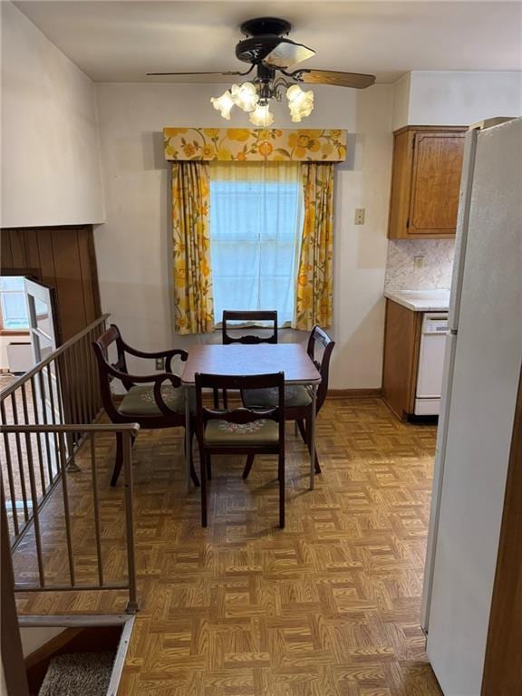 dining space with light parquet floors