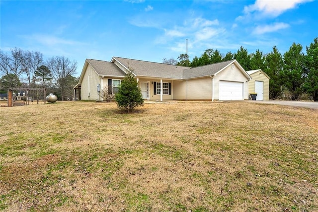 ranch-style home featuring a garage and a front yard