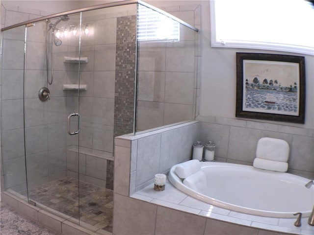 bathroom with a garden tub and a stall shower