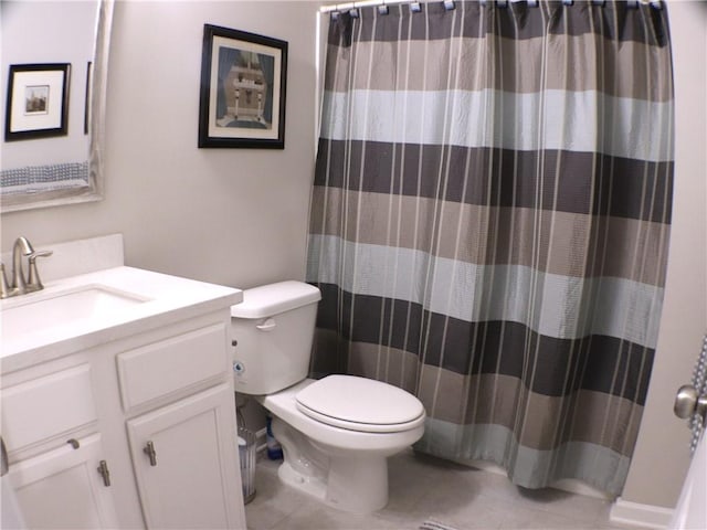bathroom with vanity, a shower with shower curtain, tile patterned floors, and toilet