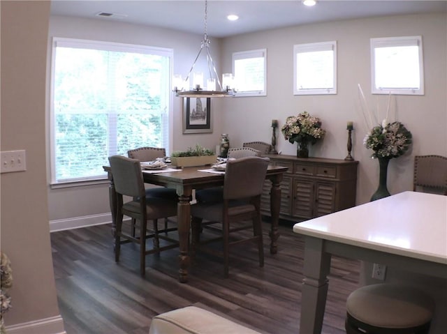 dining space with visible vents, dark wood finished floors, baseboards, a notable chandelier, and recessed lighting