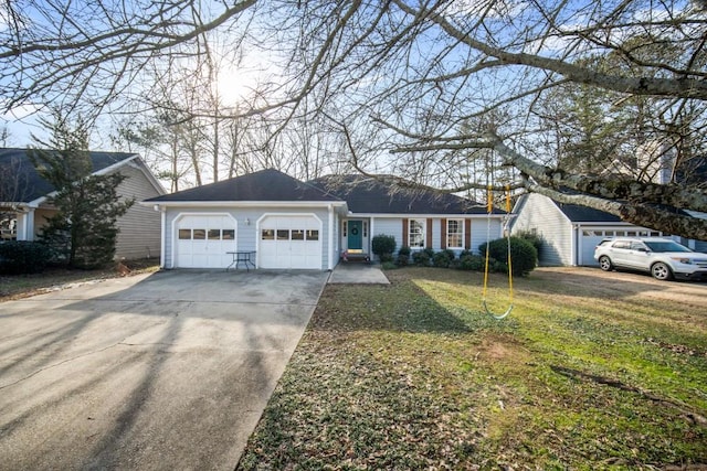 ranch-style home with a front lawn and a garage