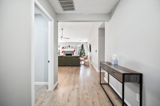 corridor featuring light hardwood / wood-style flooring