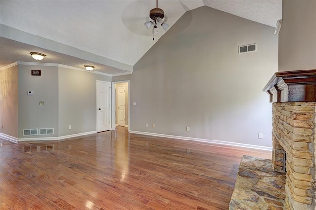 unfurnished living room featuring a ceiling fan, baseboards, visible vents, and high vaulted ceiling