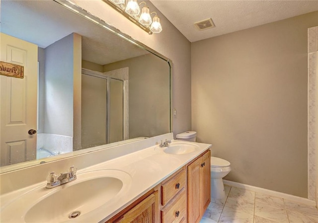 full bath featuring a sink, a stall shower, marble finish floor, and visible vents
