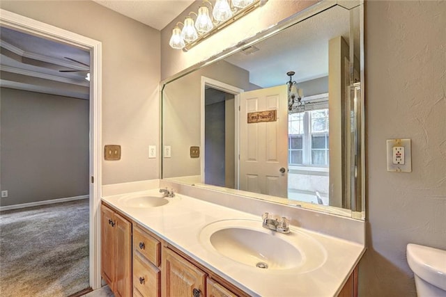 full bath featuring double vanity, a sink, visible vents, and toilet