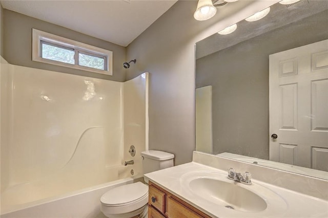 full bath featuring vanity, toilet, and shower / washtub combination