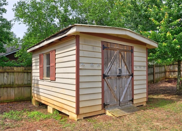 view of shed with fence