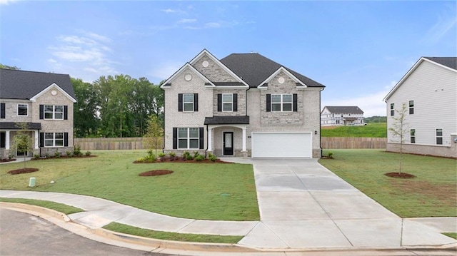 view of front of home with brick siding, a front yard, fence, a garage, and driveway