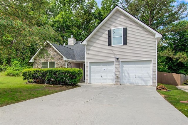 468 Berkshire Pl, Fairburn, GA 30213 - traditional-style house with an attached garage, stone siding, driveway, and a chimney