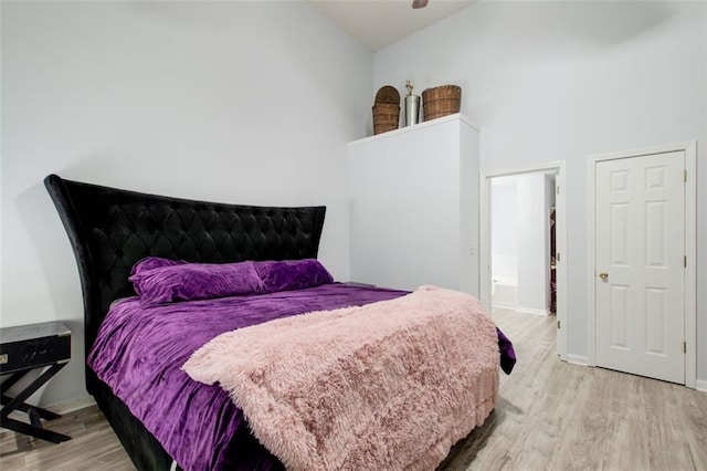 468 Berkshire Pl, Fairburn, GA 30213 - bedroom with light wood-style floors, high vaulted ceiling, and baseboards