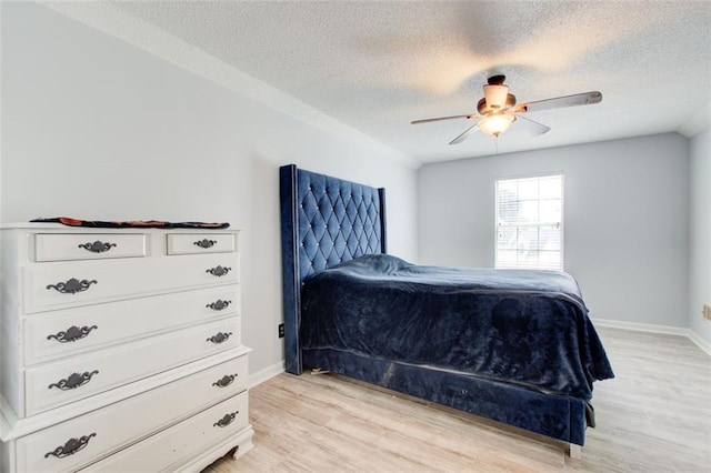 468 Berkshire Pl, Fairburn, GA 30213 - bedroom with a textured ceiling, light wood-style flooring, baseboards, and ceiling fan