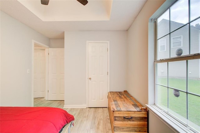 468 Berkshire Pl, Fairburn, GA 30213 - bedroom with light wood-style flooring, a raised ceiling, and ceiling fan