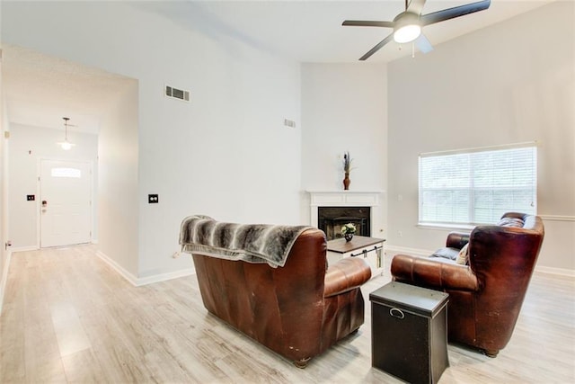 468 Berkshire Pl, Fairburn, GA 30213 - living room with light wood-style floors, ceiling fan, high vaulted ceiling, and healthy amount of natural light