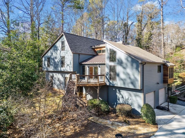 view of front facade featuring a garage and a deck