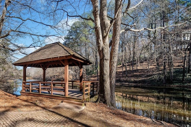 dock area with a gazebo and a water view