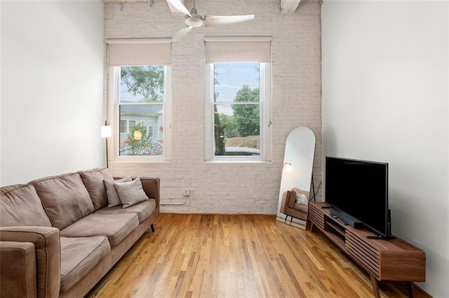 210 Walker St SW Unit 3, Atlanta, GA 30313 - living room featuring brick wall, ceiling fan, and light wood-style flooring