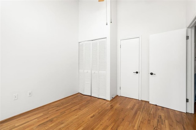 210 Walker St SW Unit 3, Atlanta, GA 30313 - unfurnished bedroom featuring hardwood / wood-style floors and two closets
