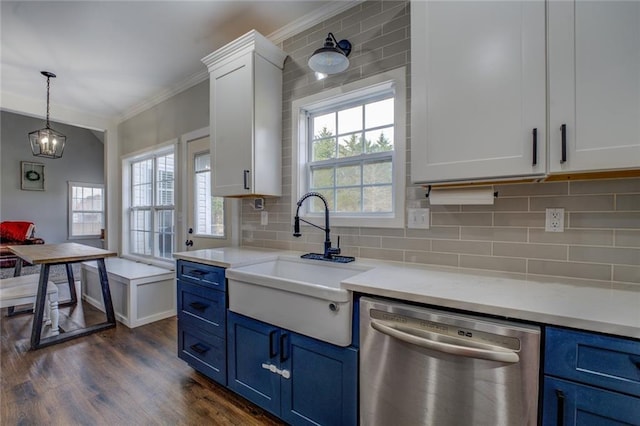 kitchen with crown molding, decorative backsplash, a sink, blue cabinets, and dishwasher