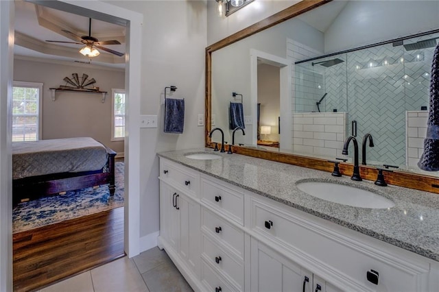 full bathroom featuring connected bathroom, ornamental molding, a sink, and tile patterned floors