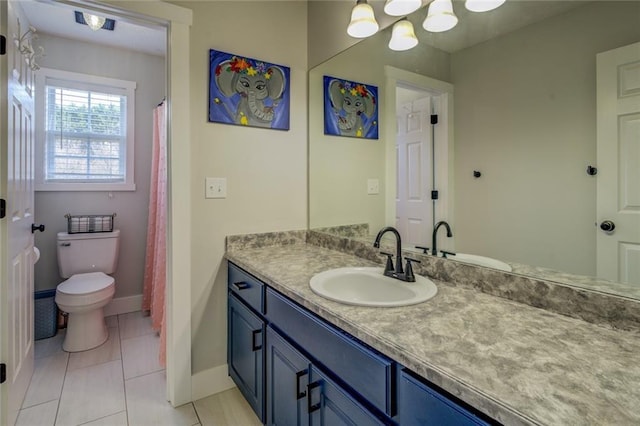 full bath with tile patterned flooring, vanity, toilet, and baseboards