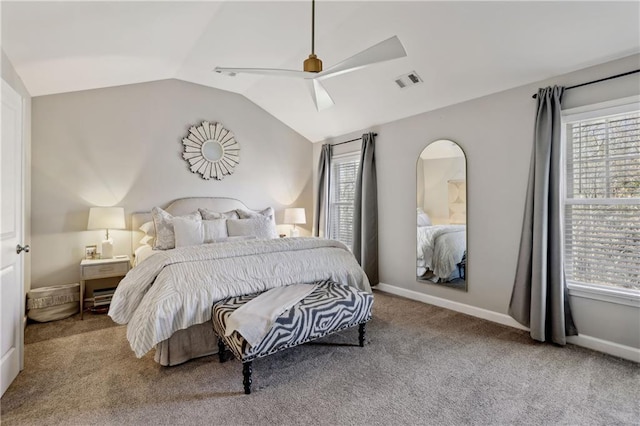 carpeted bedroom with visible vents, vaulted ceiling, baseboards, and multiple windows