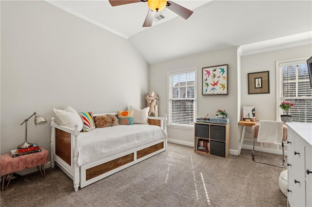 bedroom with a ceiling fan, visible vents, vaulted ceiling, baseboards, and carpet