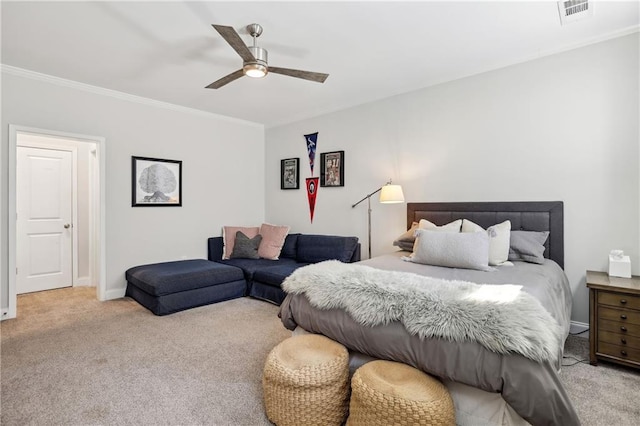 bedroom featuring baseboards, carpet, visible vents, and crown molding