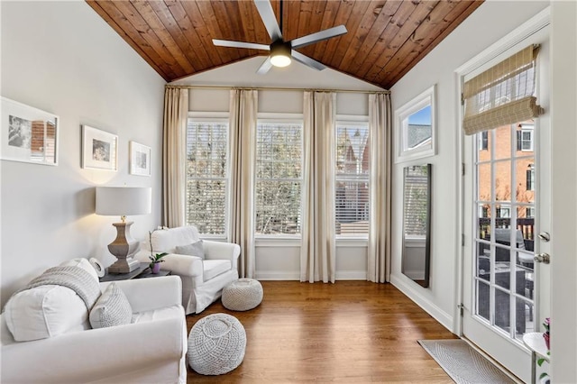 sunroom with wood ceiling, vaulted ceiling, and ceiling fan