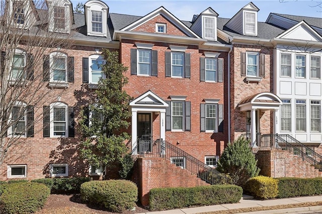 view of property with brick siding