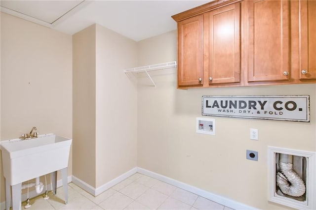 laundry area with light tile patterned floors, sink, electric dryer hookup, cabinets, and washer hookup