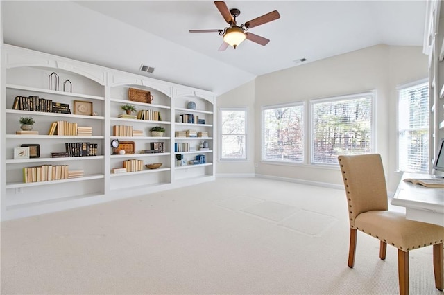 living area featuring vaulted ceiling, ceiling fan, and carpet