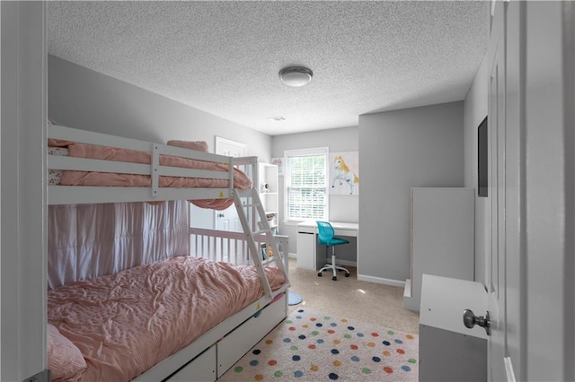 3075 Milford Chase SW, Marietta, GA 30008 - bedroom featuring a textured ceiling, a desk, and baseboards