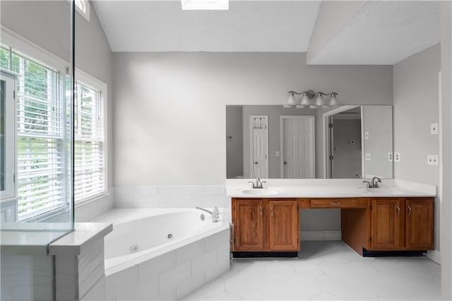 3075 Milford Chase SW, Marietta, GA 30008 - full bathroom with tile patterned flooring, a whirlpool tub, double vanity, vaulted ceiling, and a textured ceiling
