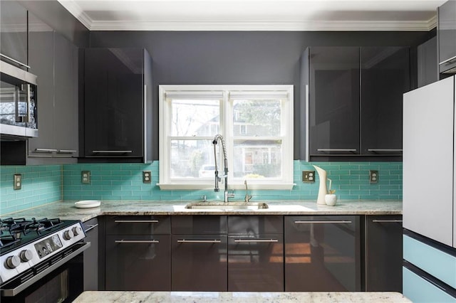 kitchen with tasteful backsplash, appliances with stainless steel finishes, light stone counters, ornamental molding, and a sink