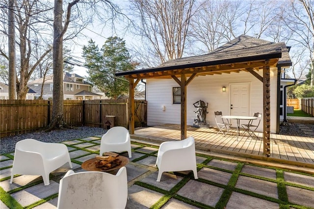 view of patio / terrace with fence private yard, outdoor dining area, and a deck