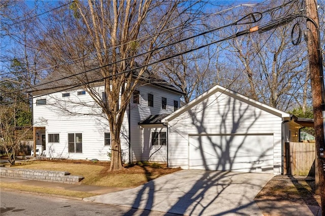 view of front of property featuring a garage and concrete driveway