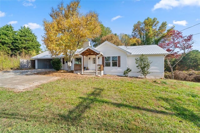 ranch-style house featuring a porch, a front lawn, and a carport