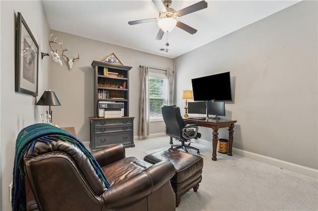 home office featuring baseboards, carpet, and a ceiling fan
