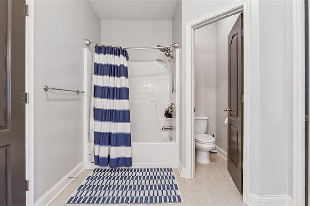 full bathroom with toilet, tile patterned floors, baseboards, and shower / tub combo